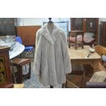A lady's Emba American mink Tourmaline natural pale beige mink jacket, with short collar and two