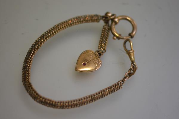 A Victorian gilt metal guard chain with swivel and plated paste set heart (18.5cm)