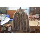 A lady's ranch mink short jacket with V collar and slash pockets to side, with satin lining and