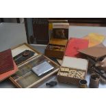 A mixed lot containing a treen carved box with pencils, a white metal cigarette case, a box with