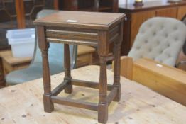 An oak miniature occasional table, the rectangular top with moulded edge raised on turned baluster