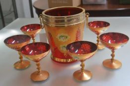An Italian Murano seven piece champagne set comprising tapered champagne bucket with brass mounts