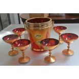 An Italian Murano seven piece champagne set comprising tapered champagne bucket with brass mounts