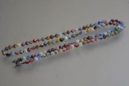 A millefiore faceted glass bead necklace, with white metal plated clasp fastening (l.44cm)