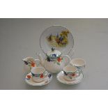An ivory ware handpainted doll's seven piece teaset and an English china painted plate (a lot) (
