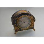 A 1920s French mantel clock with chinoiserie blue ground decorated arched case, with silvered dial