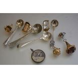 A 9ct gold tankard chased charm and a 9ct gold mounted crystal hour glass, three gilt metal