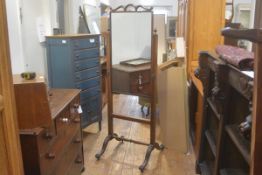 A 19thc mahogany cheval mirror stand, with urn finials and square inlaid supports, on harebell