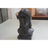 A plaster cast black painted bust of John Lennon (h.35cm x 20cm x 19cm)