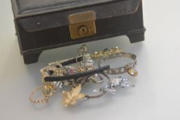 A Birmingham silver stiff hinged bangle with Celtic style knots and lion passant, a lady's quartz