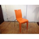 A Louis 20 chair by Philippe Starck for Vitra, in orange, with paper label.