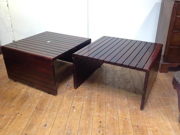 A pair of 1970's rosewood coffee or cocktail tables, each of slatted design. 44cm by 77cm by 75cm