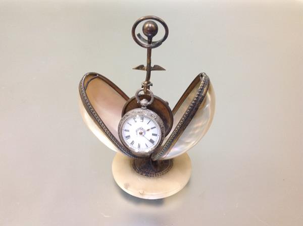 A late 19th century novelty watch stand, formed from gilt-metal mounted twin abalone shells, with