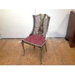 A 1920's silver lacquer Chinoiserie drawing room chair, probably Hille of London, the curved back