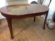 A Whytock & Reid mahogany wind-out dining table, c. 1920/30, the D-end moulded top above a plain