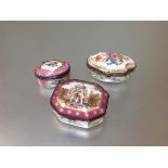 A group of three Continental porcelain table boxes, 19th century and later, the first of shaped oval