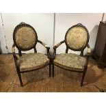 A pair of Louis XVI style fauteuils, late 19th century, the beechwood frames with remnants of