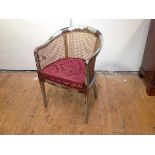 A 1920's silver lacquer Chinoiserie tub chair, probably Hille of London, with canework back and