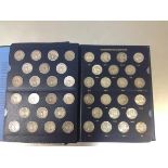 A group of US Washington Quarters in a Whitman album, 1932-64, c. 83 coins complete with mint marks,