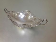 A George V silver twin-handled cake or bread basket, Josiah Williams & Co., London 1927, oval, the