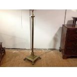 A brass Corinthian columnar standard lamp, the fluted column raised on a stepped square base