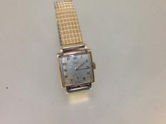 A vintage J.W. Benson gentleman's 9ct gold wristwatch, the square silvered dial with Arabic