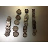 A group of U.S. coins by Barber: 43 dimes (VG to VF); 12 quarters, 5 1/2 dollars; and 7 standing