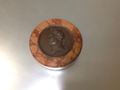 A 19th century bronze and marble paperweight, inset with a patinated roundel of Napoleon after