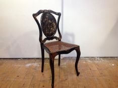 A 19th century mother-of-pearl inlaid and painted papier mache lady's drawing room chair, the oval