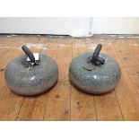 A pair of Scottish granite curling stones, early 20th century, each with brass-bound wooden