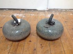 A pair of Scottish granite curling stones, early 20th century, each with brass-bound wooden