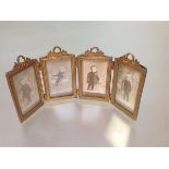 A French gilt-metal quadtych folding photograph frame, each rectangular aperture beneath a floral