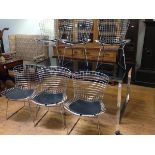 A set of six metal wirework side chairs after a design by Harry Bertoia, of bent and welded rod