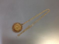 An Edwardian full sovereign, mounted in 9ct gold as a pendant, the coin dated 1908, within a 9ct