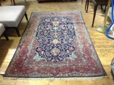 A Hamadan rug, finely knotted, the central panel with hanging lantern design with arabesques and