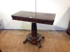 A William IV rosewood foldover tea table, the rectangular top with rounded corners over a massive