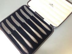 A cased set of six George VI silver-handled fruit knives, Brook & Son, Birmingham 1942, each with