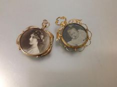 Two late 19th century yellow metal double-sided open pendant lockets, each with glazed circular