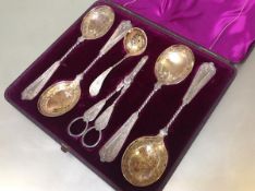 A 19th century silver-plated cased six-piece fruit service, comprising a set of four serving spoons,