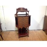 An Edwardian inlaid mahogany music cabinet, in the Art Nouveau taste, the rectangular top with
