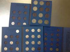 A group of four Whitman folders of mixed GB pre-1947 coins (c. 55)