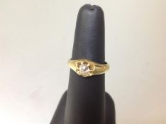 A diamond-set 18ct gold ring, the old-cut stone gypsy set on a tapering band, diamond approx. 0.33
