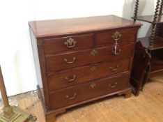 A George III mahogany chest of drawers, the rectangular top with moulded edge over two short and