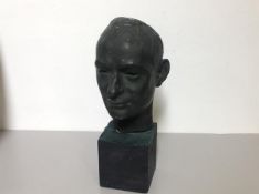 20th Century School, a Bronze Mask of a Man, unsigned, mounted on a stone base. Overall 41cm