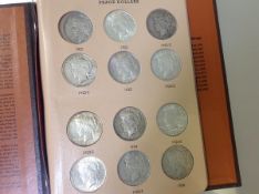 A group of approximately 23 US Peace dollars 1922-35 including mint marks (missing 1921),