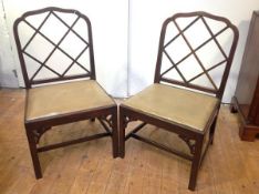 A pair of Cockpen style mahogany side or hall chairs, early 20th century, each with shaped crest