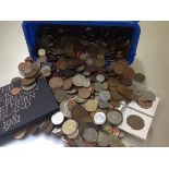 A box containing a quantity of UK and World coins, mostly lower value, several hundred