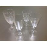 A group of 19th century and later baluster stem drinking glasses comprising: a rummer with bucket