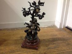 After Auguste Moreau, a patinated bronze sculptural lamp, early 20th century, modelled as Cupid