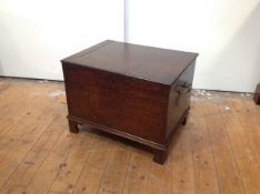 A small George III mahogany chest or coffer, the rectangular hinged top over a conforming case
